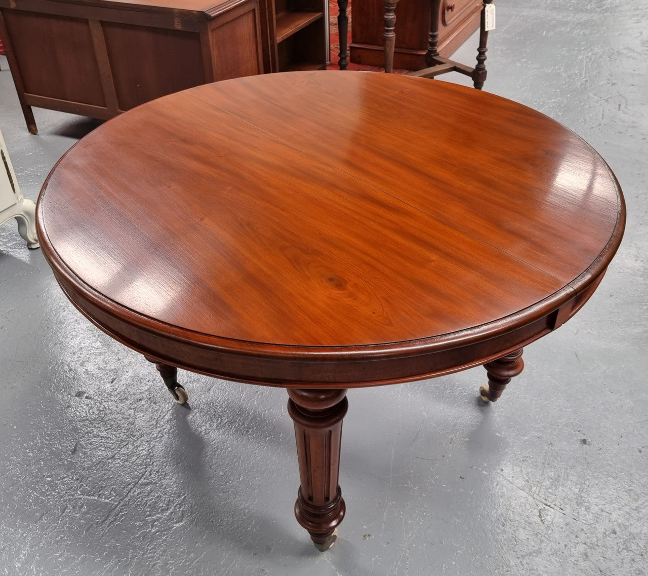 Amazing Victorian round Mahogany extension table. It comes with one extension leaf which can be added to the center of table when required. Sourced Locally and in good original detailed condition.
