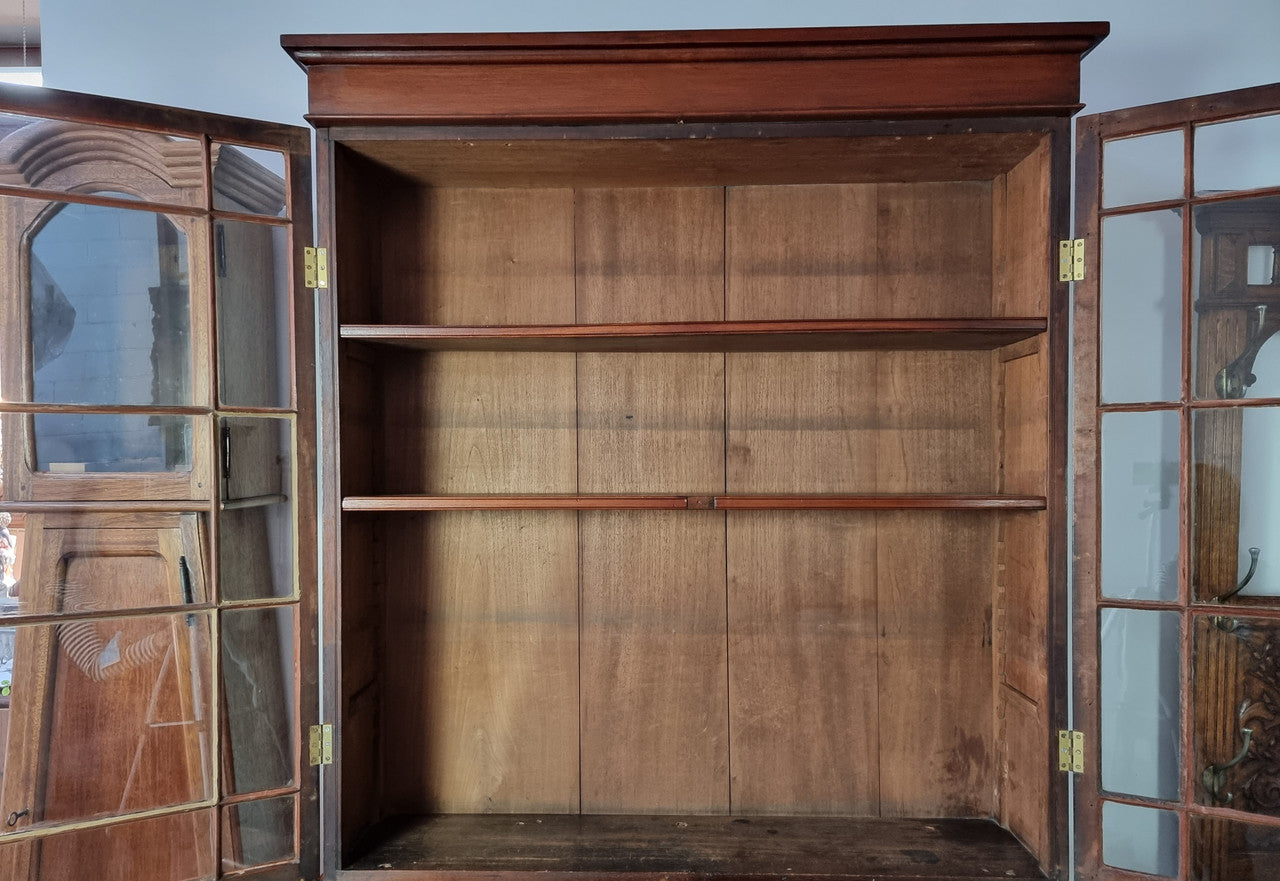 Rare early Australian colonial full Cedar bookcase. Plenty of storage underneath and glass top doors open up too three fully adjustable shelves. In good restored condition.