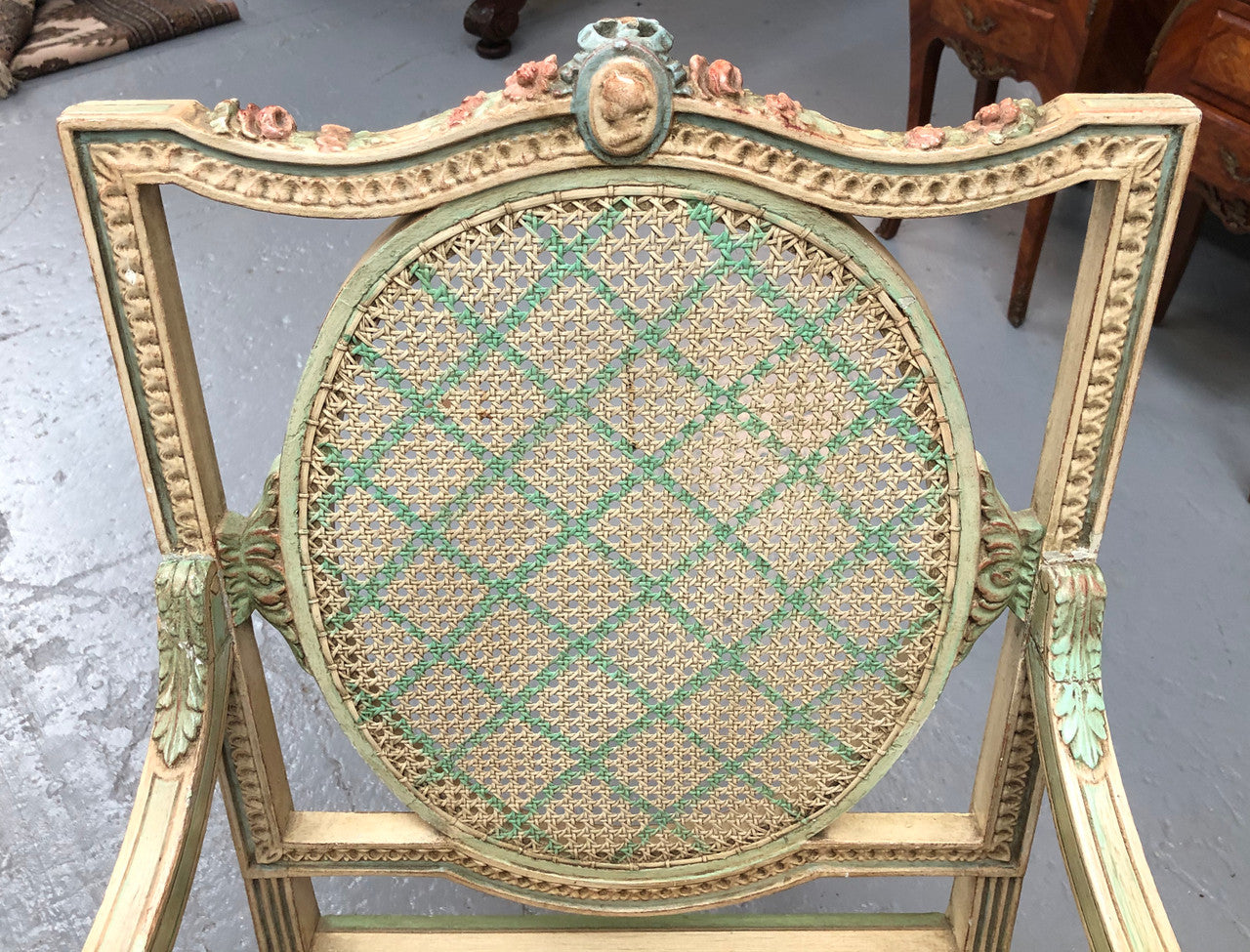 Painted French Louis XVI style cane panel arm chair. Paint is original and it is in very good original condition.
