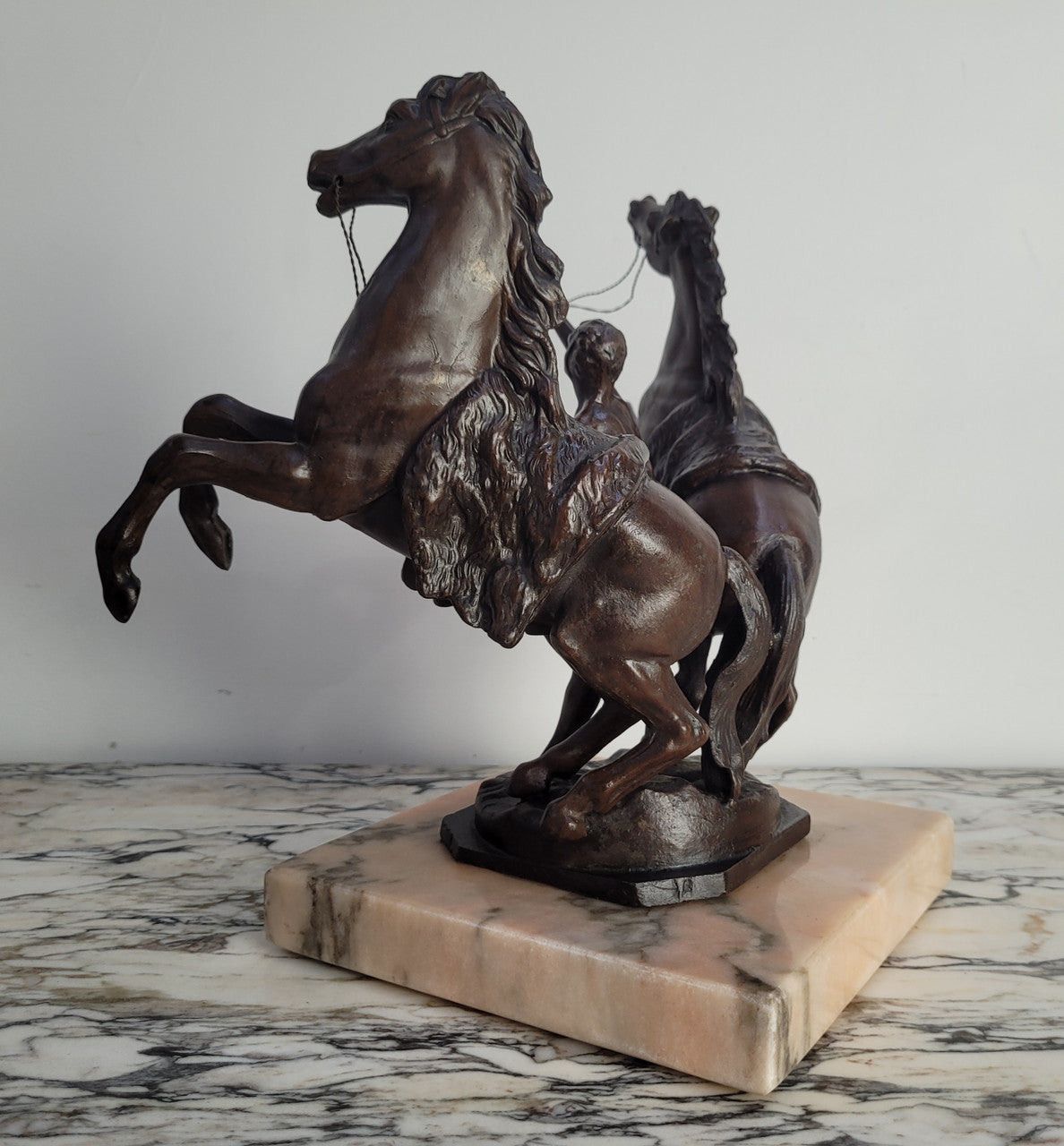 French Art Deco cold painted bronze metal marley horses style statue on a marble base. It is in good condition.