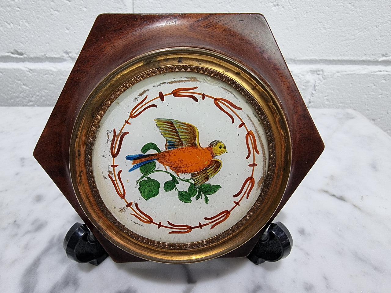 Antique French hand painted reverse on glass miniature in its original frame. In good original condition, please view photos as they help form part of the description.