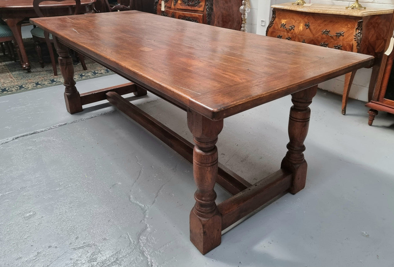 Vintage French Oak stretcher base farmhouse table. It is in good original condition.