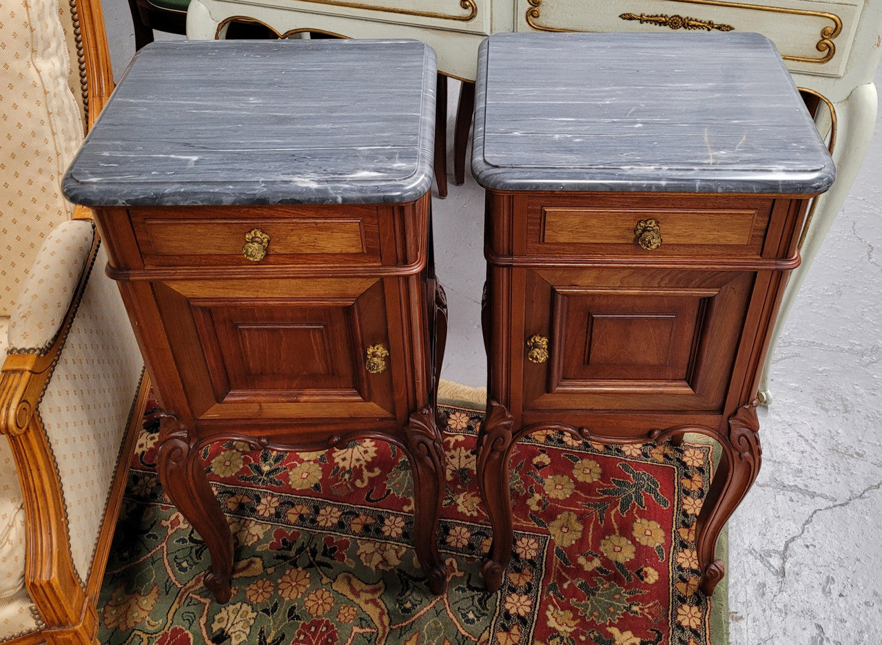 Pair of Walnut Louis XV style grey marble top bedside cabinets. Single drawer, one cupboard and lovely French cabriole legs. They have been sourced from France and are in good original condition.