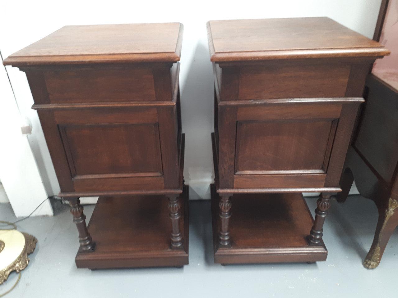 A hard to find pair of French Oak wooden top bedside cabinets. In good original condition. Circa 1920.
