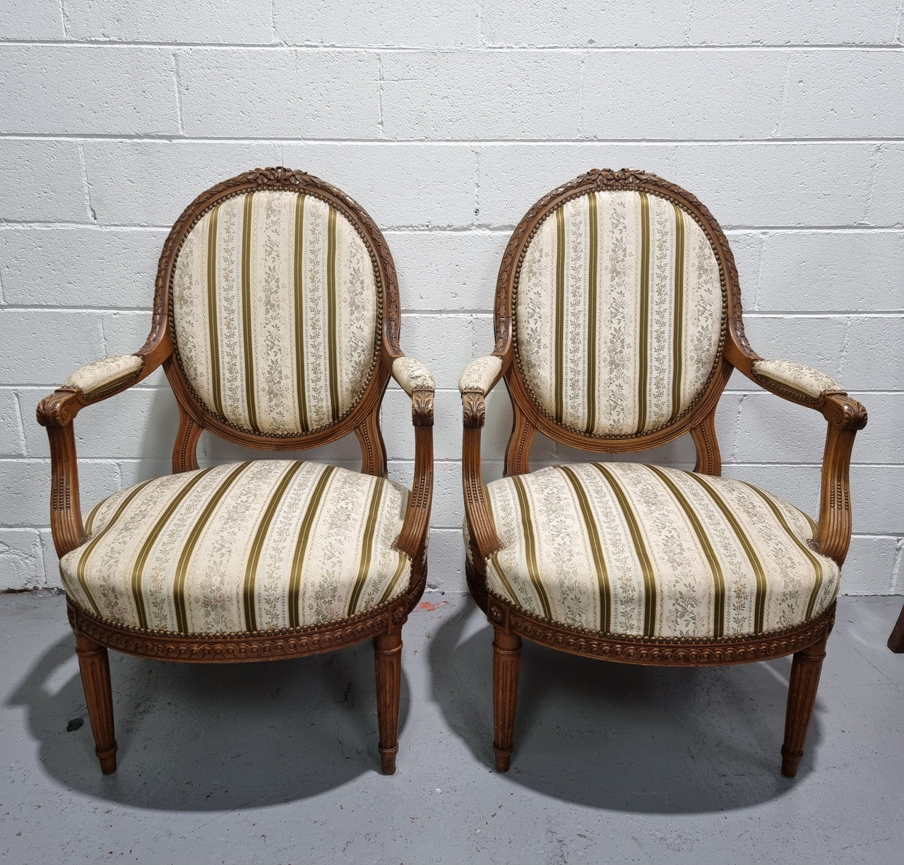 Pair of French Louis XV matching carved armchairs. They are in good overall condition with some slight wear to fabric, please view photos as they help form part of the description.