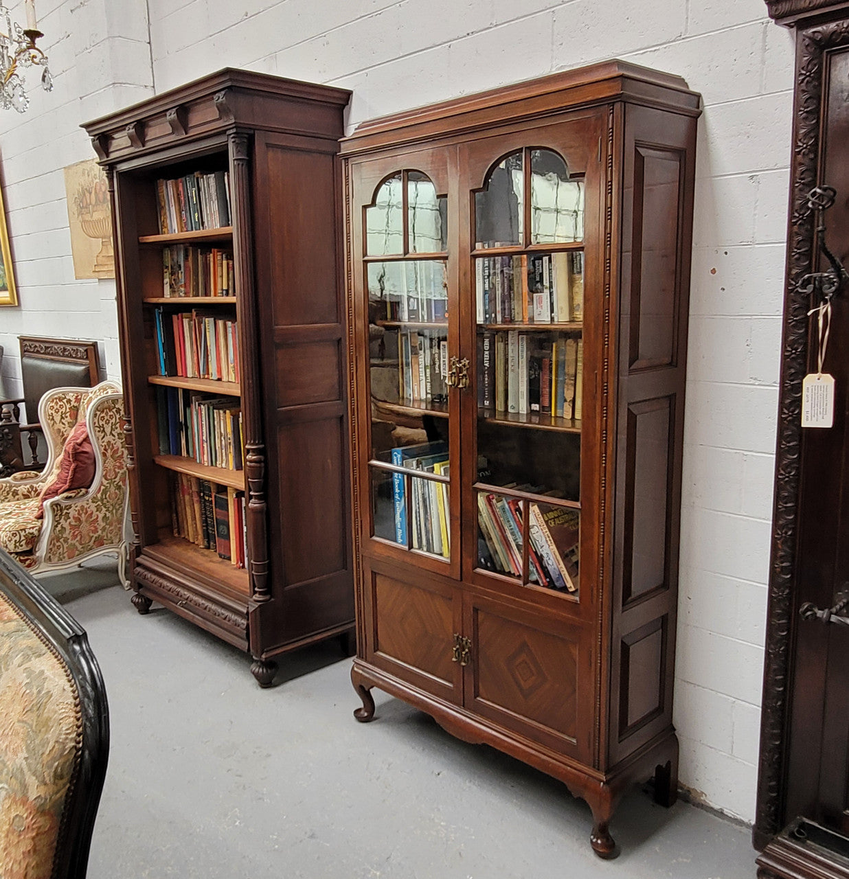 Beautiful four door Walnut bookcase with glass doors. The top section has two fully adjustable shelves and it is of pleasing narrow proportions. It is in good original detailed condition.
