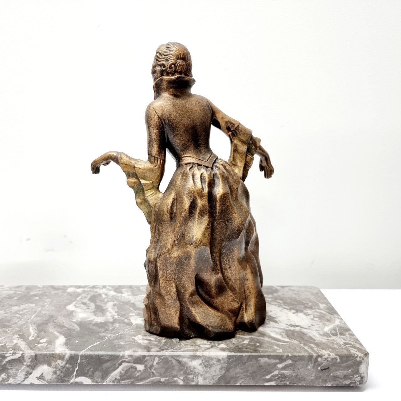 Art Deco gilt metal lady and deer statue on a lovely grey marble base. It has been sourced from France and is in good original condition. The marble does have some minor chips and wear due to age, please view photos as they help form part of the description. Please contact us if you would like additional photos.