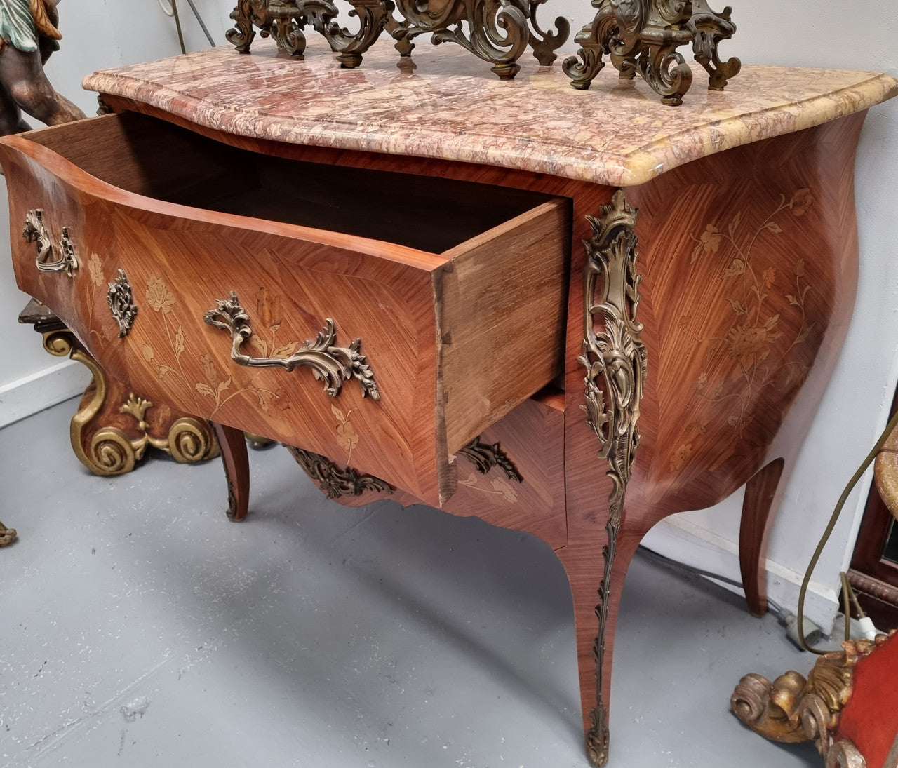 Stunning Louis XV style marquetry inlay marble top two drawer commode. It has decorative ormolu mounts and beautiful marble top. In good original detailed condition.