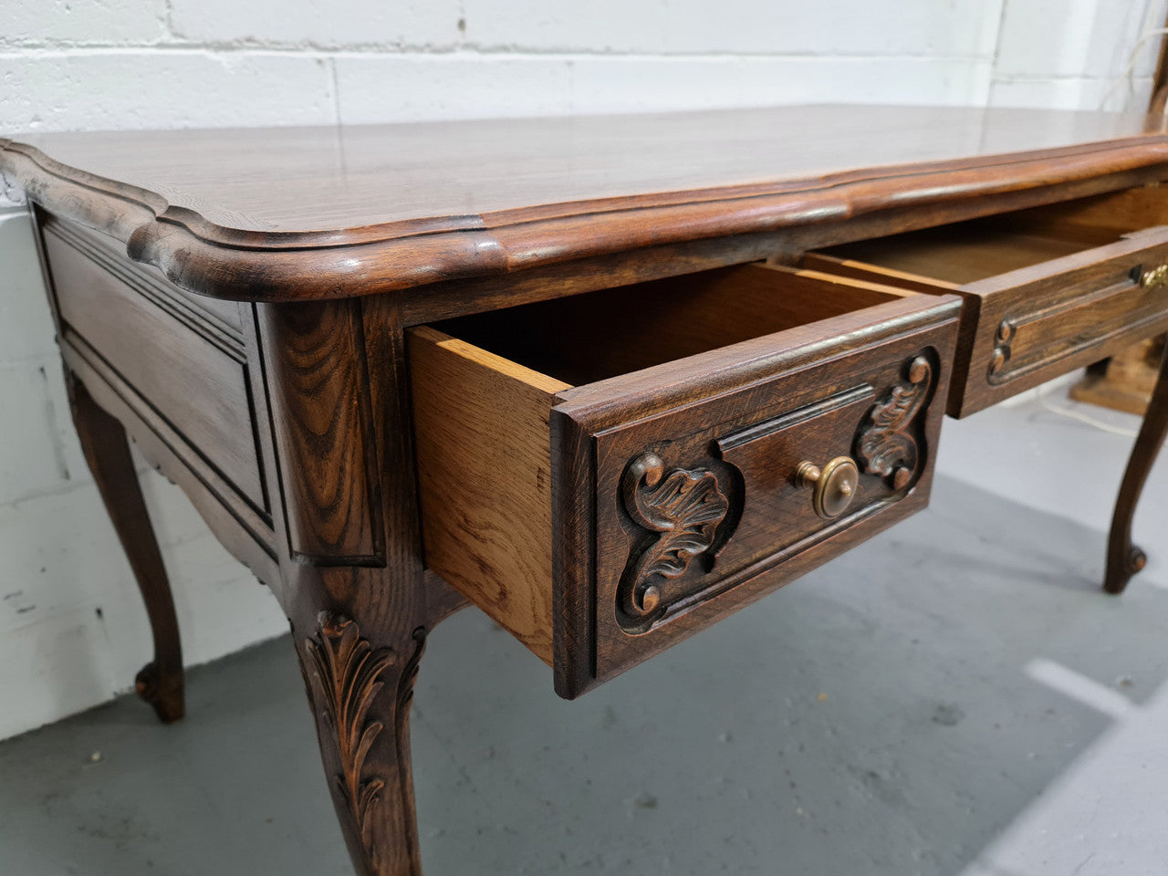 Attractive large Louis XV style Oak faux partners desk. Nicely carved details with three large functioning drawers, and three faux drawers at the back. In good original detailed condition.