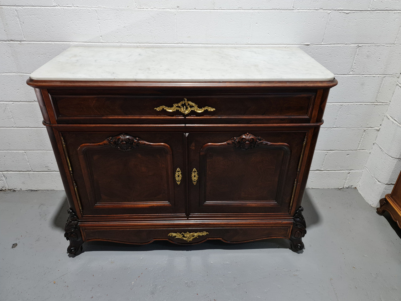 Stunning Rosewood Marble Topped Secretaire with two cupboards. Cupboards open to three fitted drawers and an additional secret drawer beneath the cupboard. All sitting on lovely carved legs and decorated with ormolu mounts. Circa: 1860. In good original detailed condition.