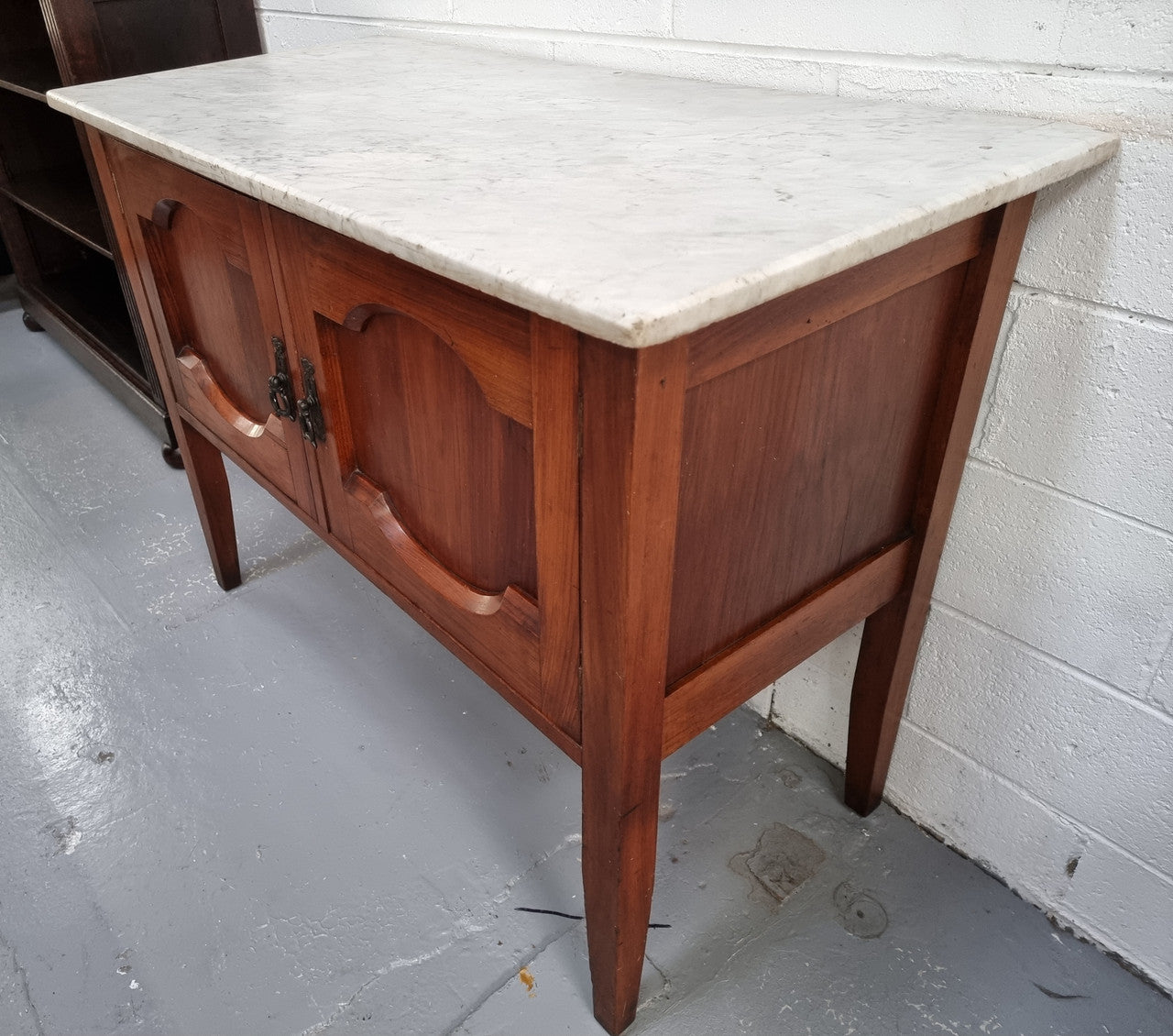 Blackwood two door white marble top cabinet. This would be ideal to be used as an entertainment unit, a TV stand or TV cabinet. In good original condition.