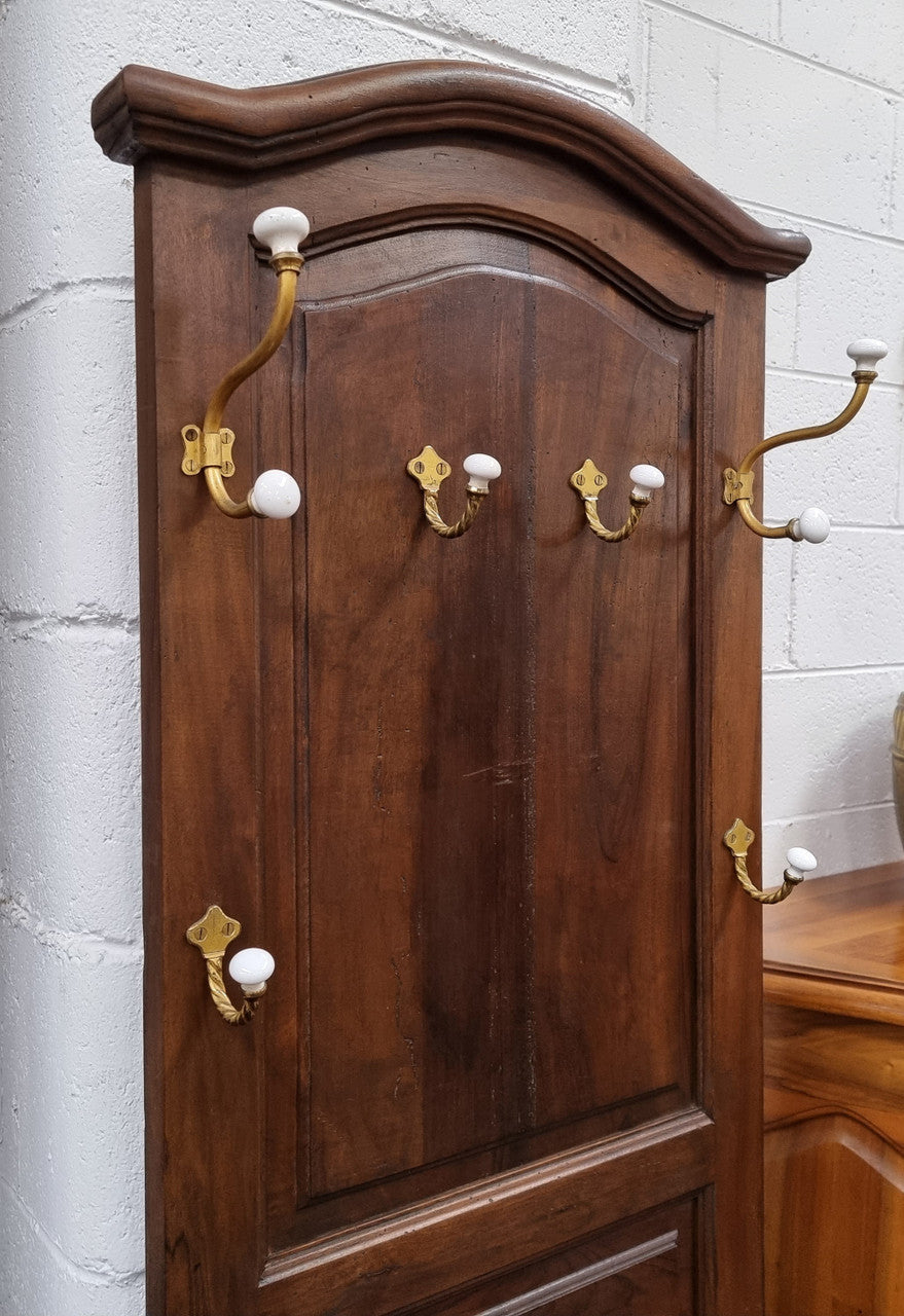 Lovely entrance piece with shelf and single door cupboard, topped with a section for hanging jackets, hats etc. Sourced from France and in good original detailed condition.