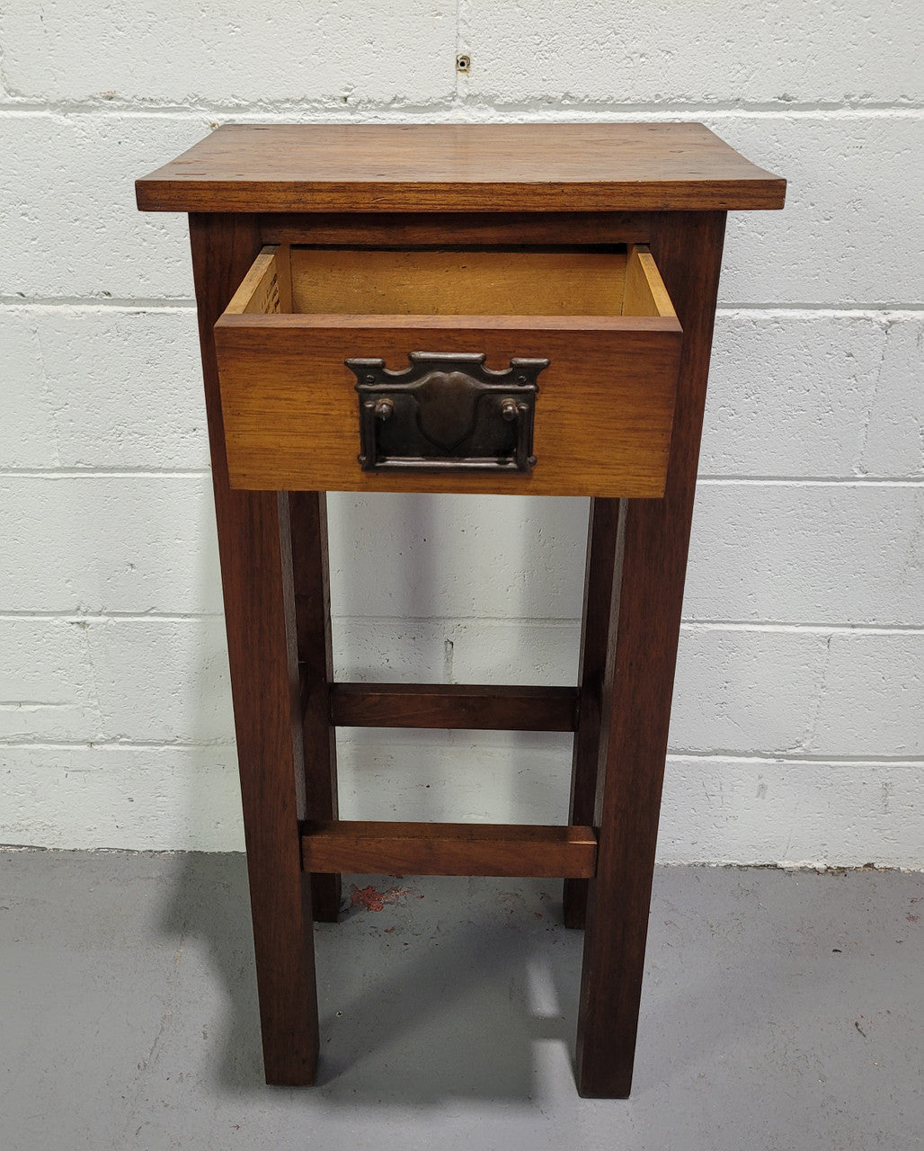 Small Arts and Crafts side table/bedside table. With drawer and is in good original detailed condition.