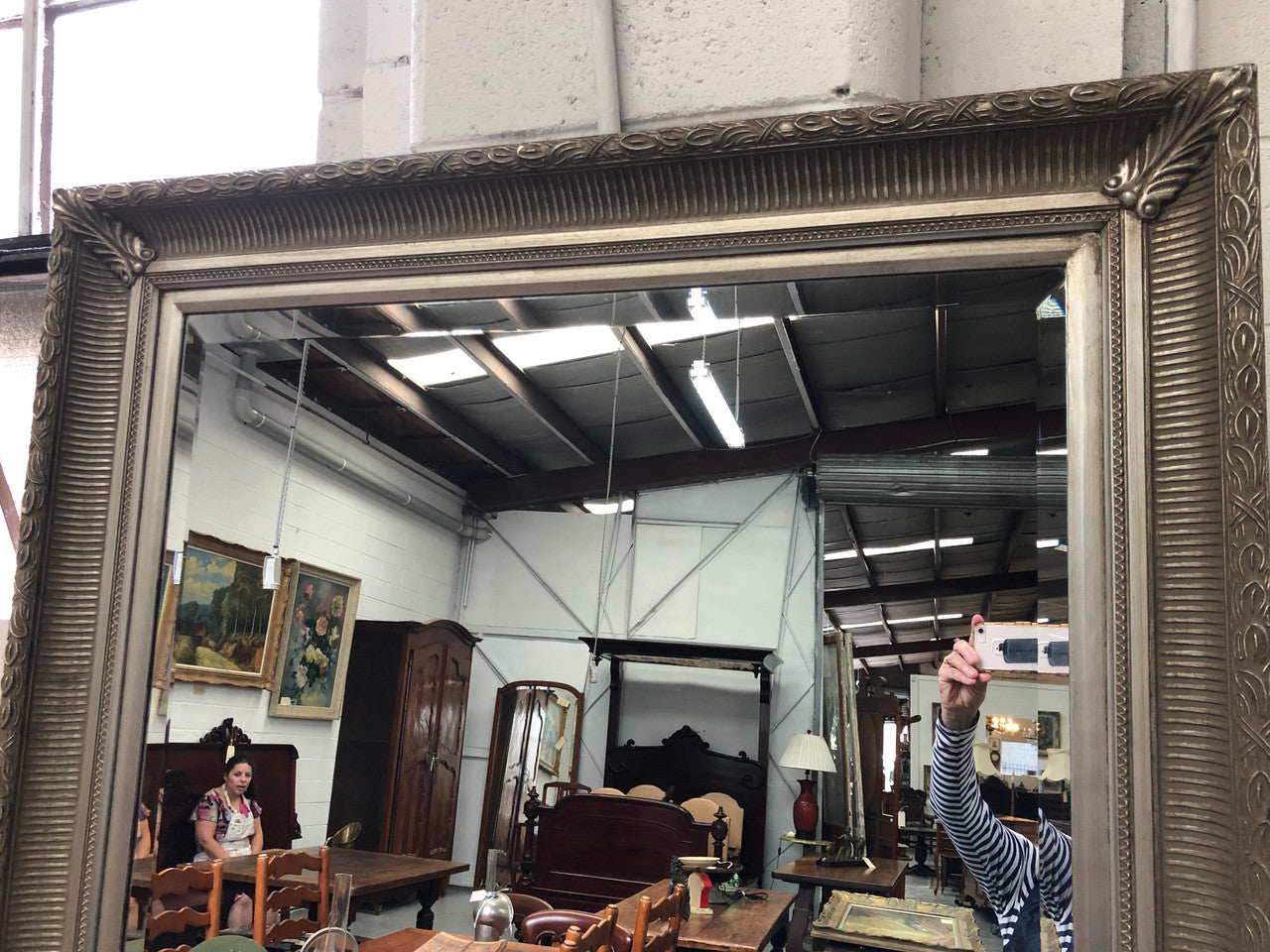 Beautiful Vintage French style silver gilt mirror of large proportions. This beautiful mirror could be used a freestanding floor mirror or it has a wire so it can be hung up on wall as well. It is in good original condition.