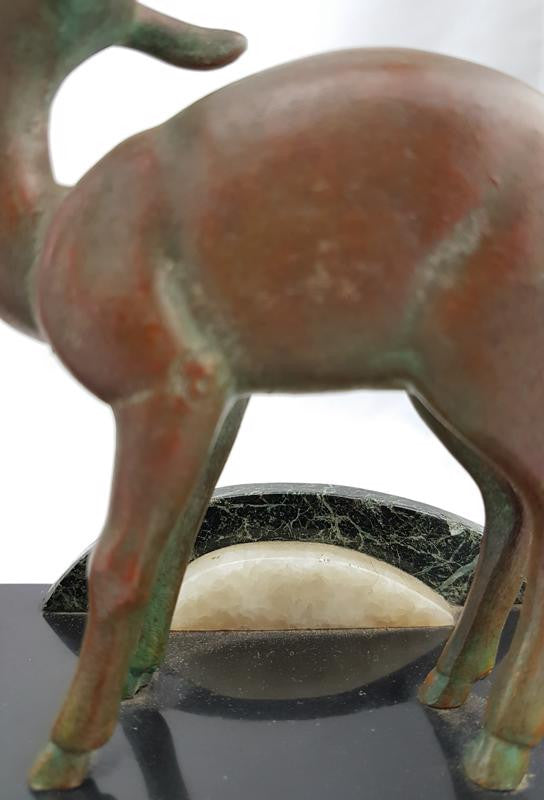 Absolutely gorgeous French cold painted metal Art Deco Statue of a lady and two deers on a marble base. Signed piece and in good original condition.