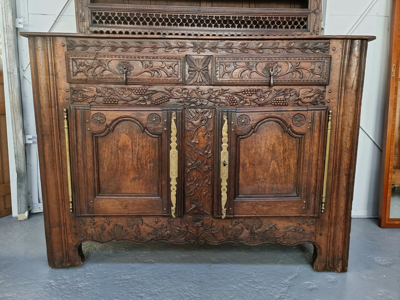 Absolutely stunning French early 18th century kitchen dresser/Vaisselier with beautiful carving and cupboards for storage . The top carved section has four shelves for display and is in good original detailed condition.