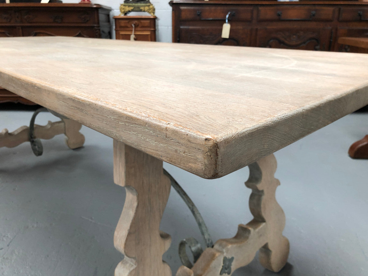 Limed French Oak Farmhouse table with decorative iron base. In good original detailed condition.