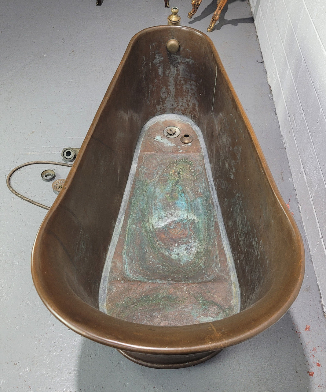 Sourced from France a rare full copper Antique bath tub on feet and includes an overflow, fittings, taps ect. In good original condition.