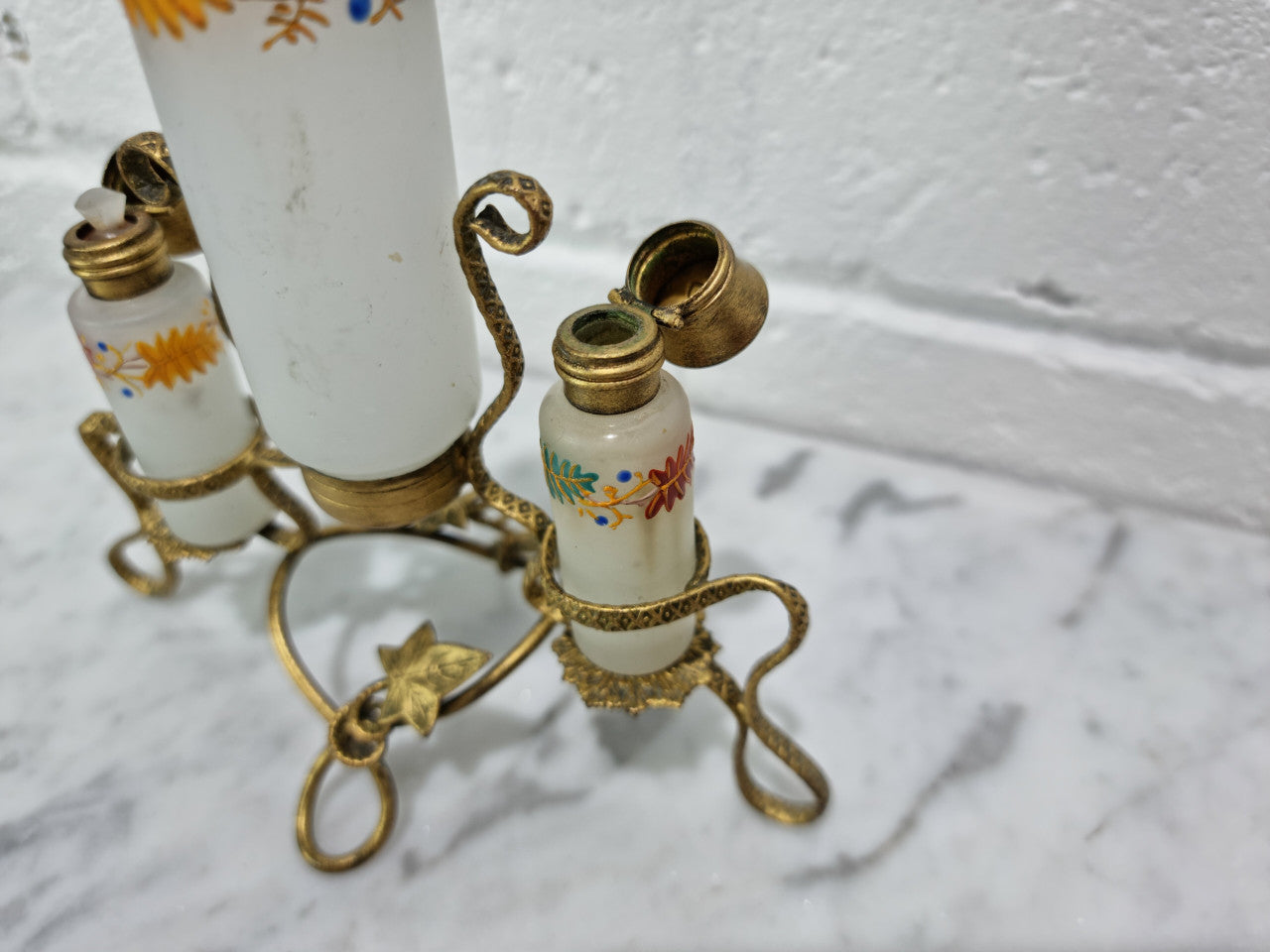 French 19th century perfume set in a gilt metal stand. Opaline glass beautifully hand painted and is in good original condition, please view photos as they help form part of the description.