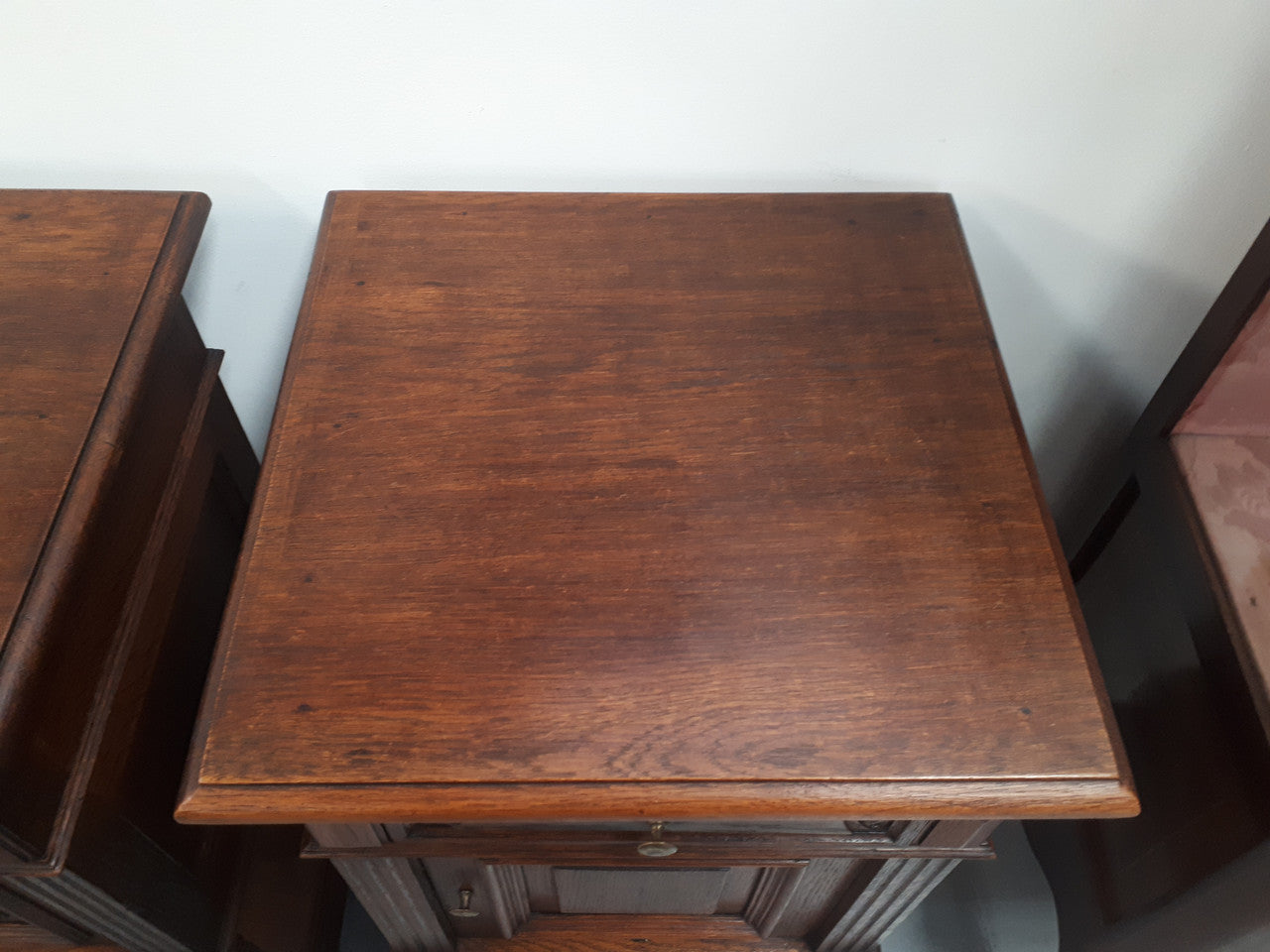 A hard to find pair of French Oak wooden top bedside cabinets. In good original condition. Circa 1920.