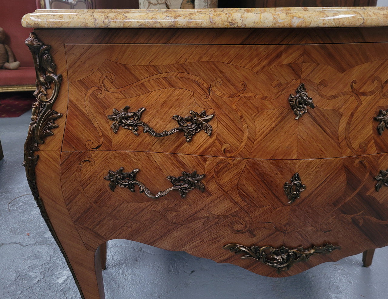 An elegant French Louis XV style kingwood two drawer commode with beautiful decorative inlay and ormolu mounts. Stunning coloured marble top and is in good original detailed condition.
