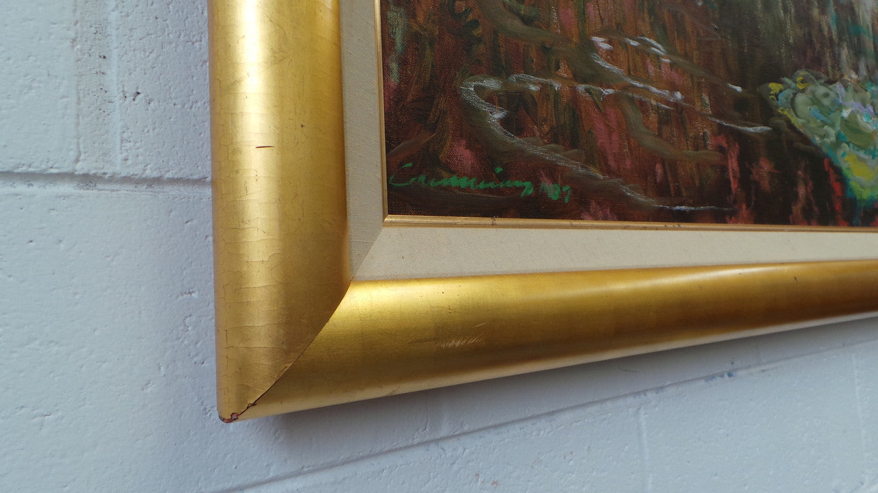 A beautiful Framed oil on canvas in vibrant colours and framed in a lovely gold frame. This piece is signed by artist John Cumming from "The Mill Gallery" and still has its original gallery card as shown in picture. It is in good original condition.