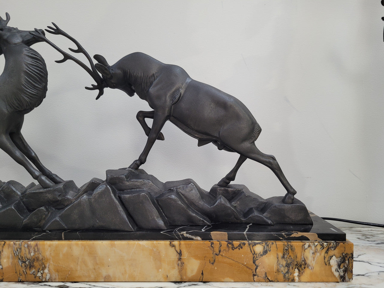 French Art Deco bronzed spelter and marble"Fighting Stags" statue by renowned artist and sculptor "Irenee Rochard".