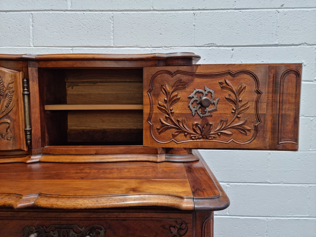 Stunning 19th Century French Walnut Buffet à Glissant from Provence, France. This is an exceptional charming piece and very functional with plenty of storage space, two large cupboards at the bottom, two drawers in the middle and two sliding doors either side at the top and finished off with a small central cupboard. In good original detailed condition.