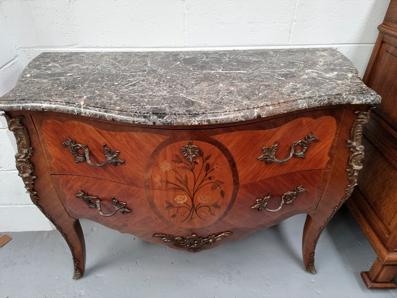 Beautiful French walnut Louis XV style two drawer commode. With a lovely floral marquetry inlaid design and marble top. It is in good original detailed condition.