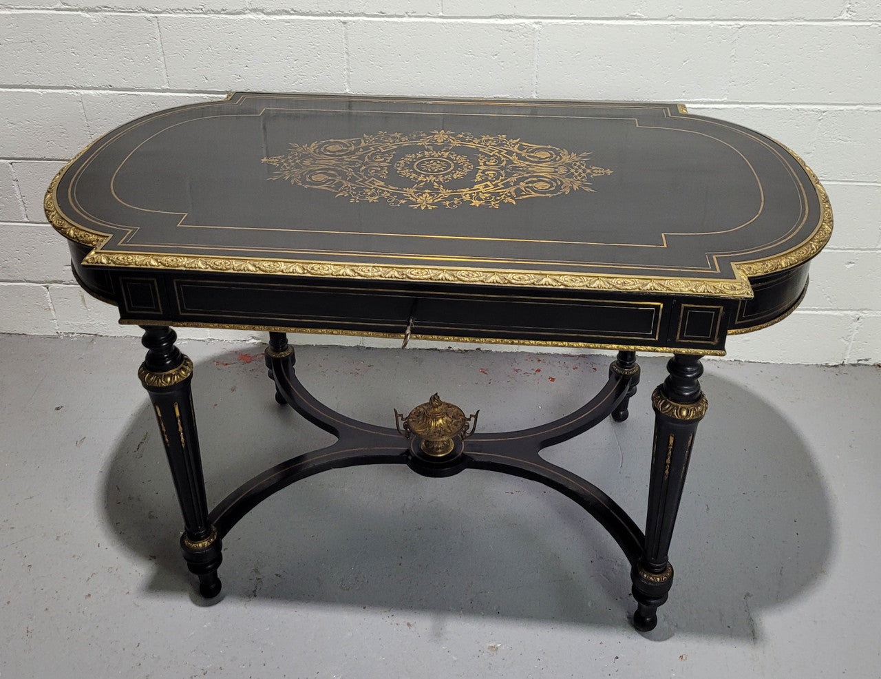 19th Century Napoleon III boulle ebonized centre table. Beautiful decorative mounts and has a drawer on one side. In good restored condition.