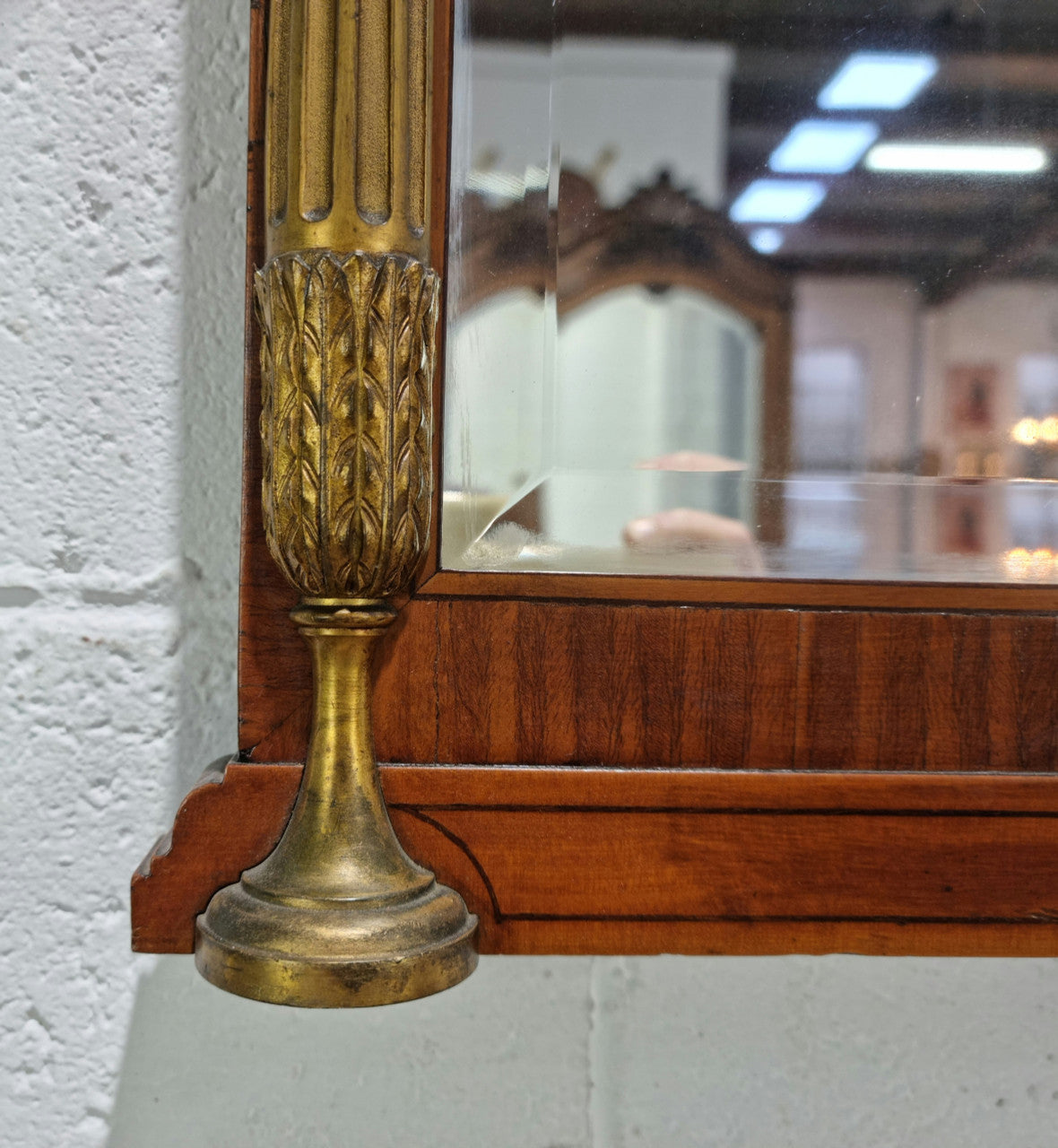 Decorative late 19th Century mahogany French wall mirror with brass swivel candle holders and brass detail. In good original detailed condition.