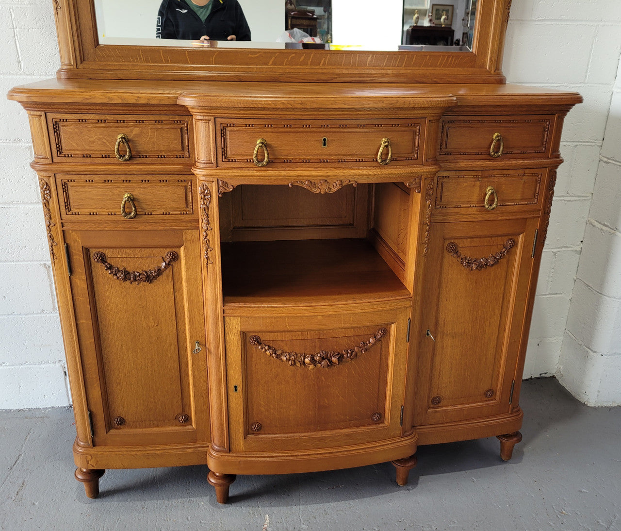 Beautiful French Oak Louis XVI Style nicely carved sideboard with a lovely parquetry top and mirror. It has five drawers and three cupboards for all your storage needs. In good original detailed condition.