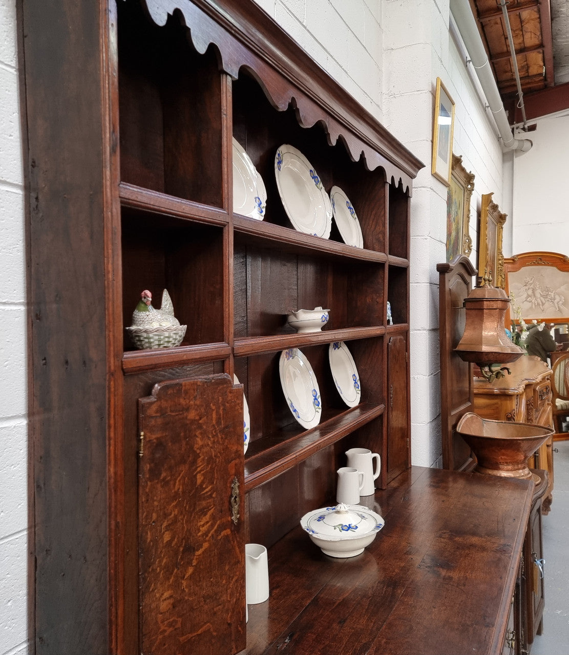 18th Century English Oak Farmhouse dresser of grand proportions. It was sourced in France and not only looks amazing but also has plenty of practical storage space. It is in good original detailed condition.