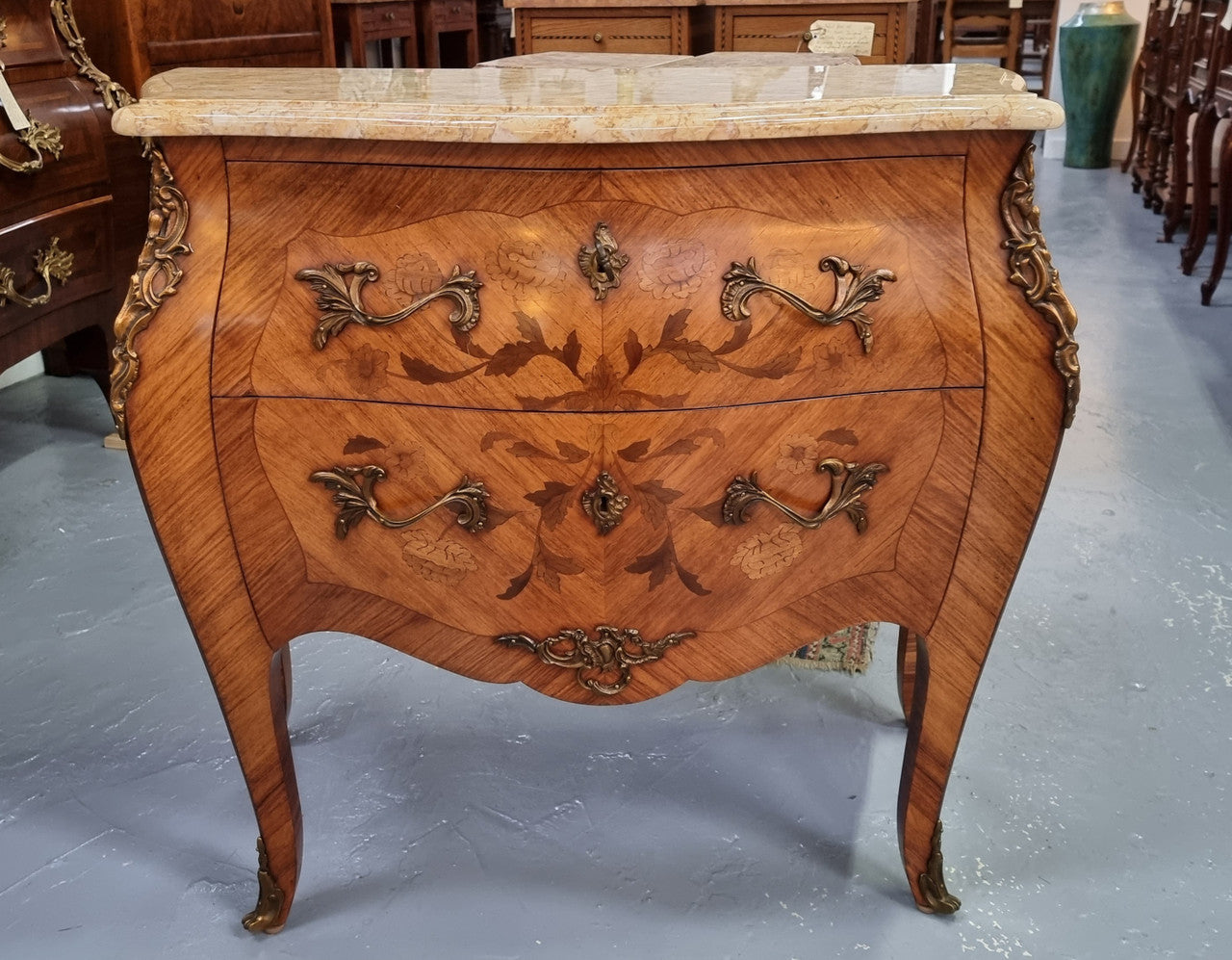 Fabulous French petite inlaid two drawer commode with ormolu mounts and lovely marble top. It is in good original detailed condition.