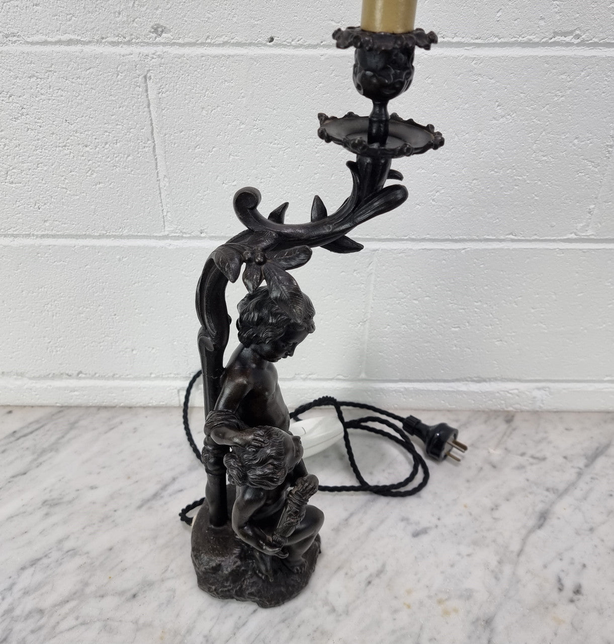 Antique French bronzed metal lamp with cherub's. in very good working original detailed condition.