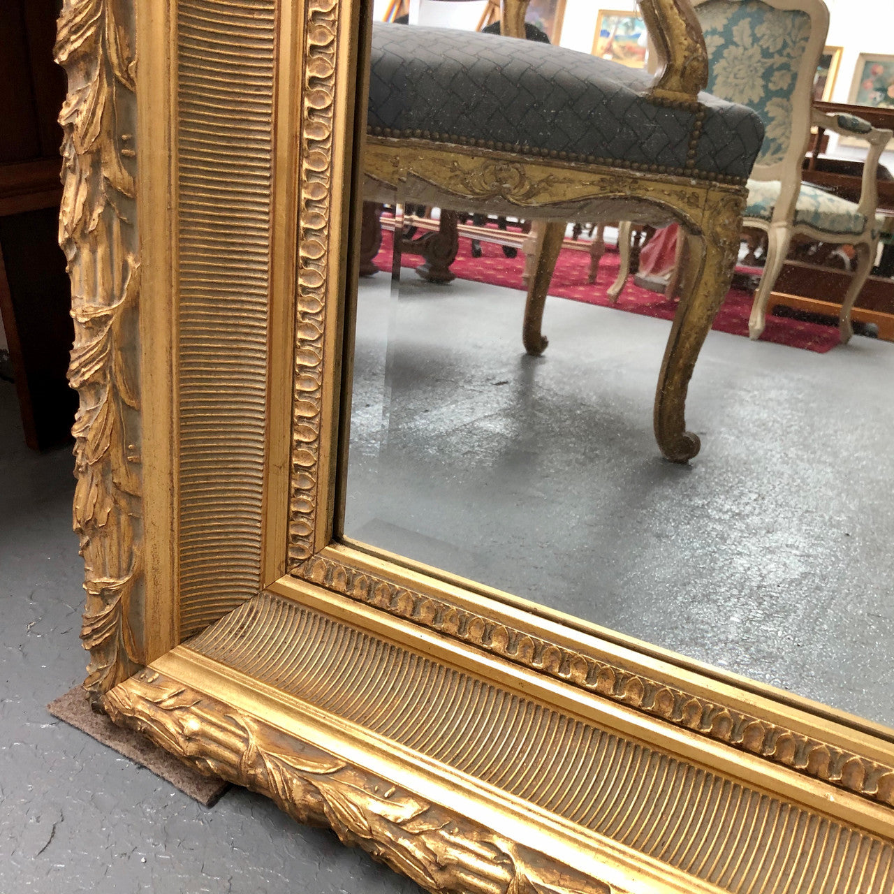 Very large French style mirror with beveled glass. In very good original condition.