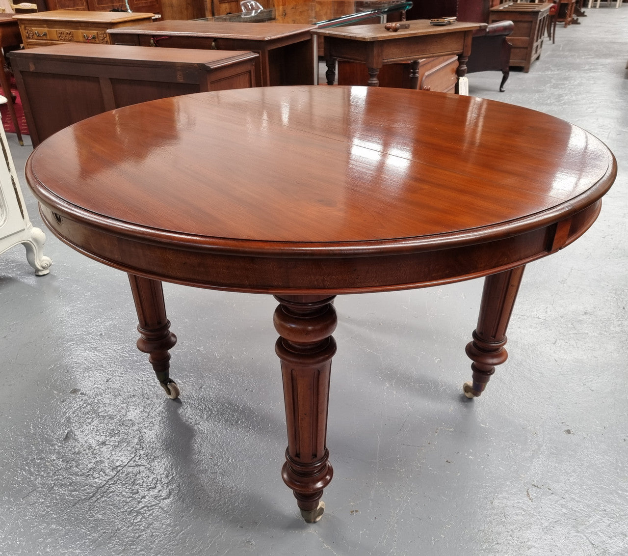 Amazing Victorian round Mahogany extension table. It comes with one extension leaf which can be added to the center of table when required. Sourced Locally and in good original detailed condition.