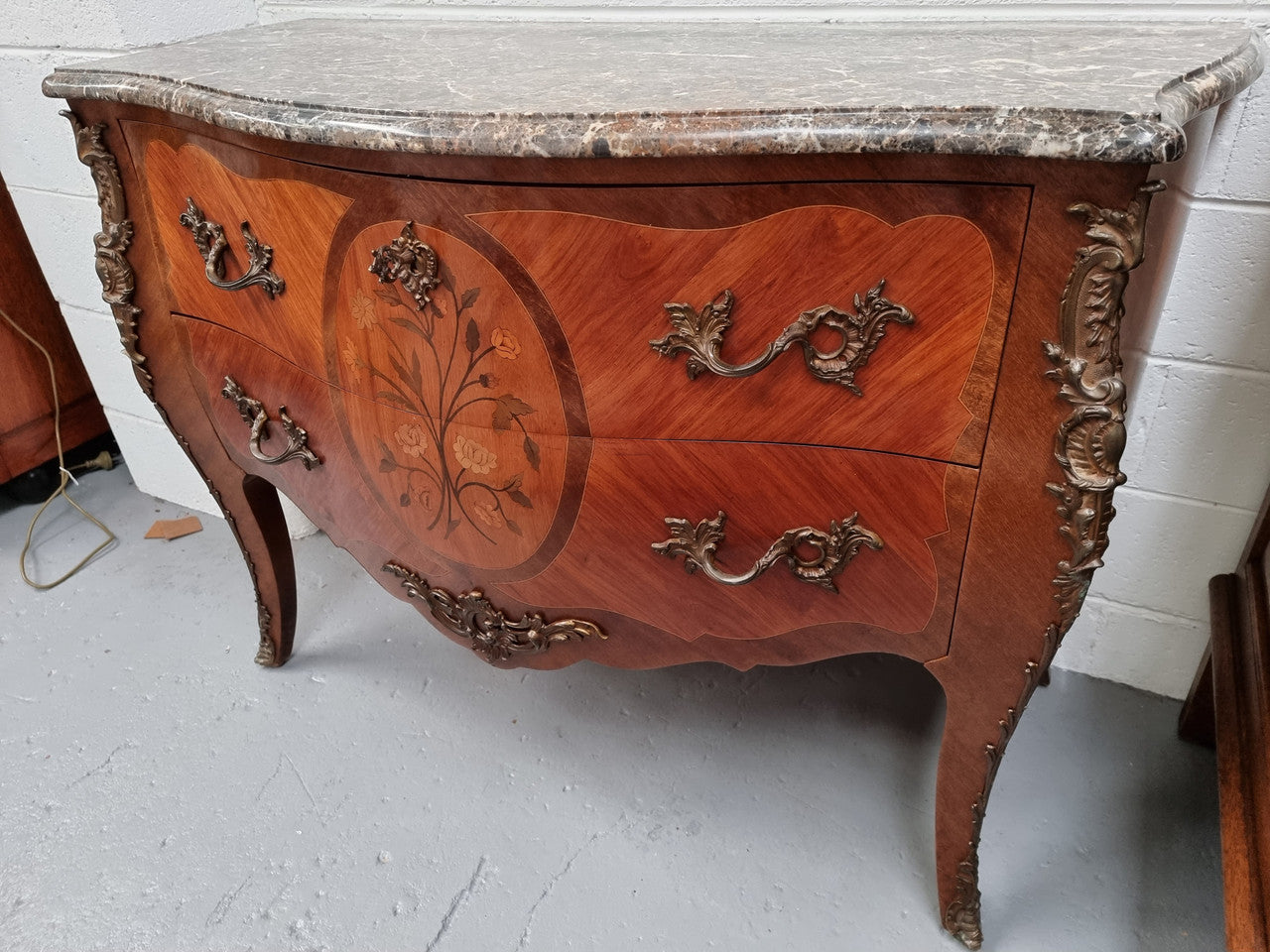 Beautiful French walnut Louis XV style two drawer commode. With a lovely floral marquetry inlaid design and marble top. It is in good original detailed condition.