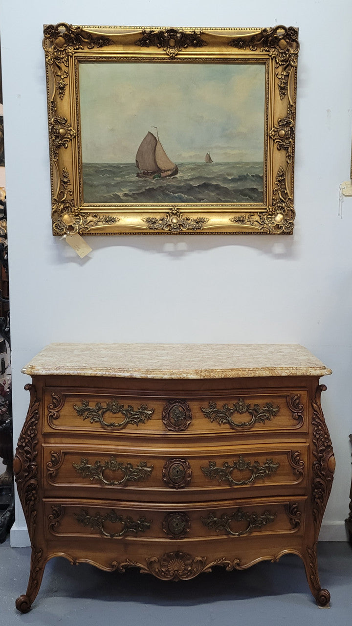 Impressive Louis XV style three drawer walnut commode. Ormolu handles and bevelled marble top complimenting detailed carving. In very good original detailed condition.
