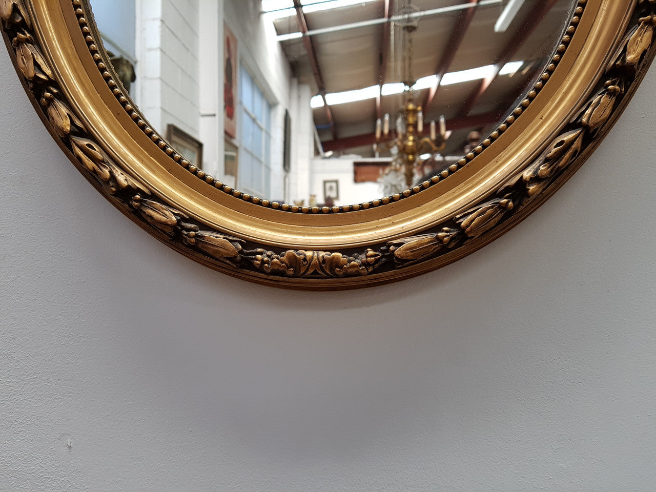 Antique French Gilt Oval Shape Mirror With Ribbon Crest