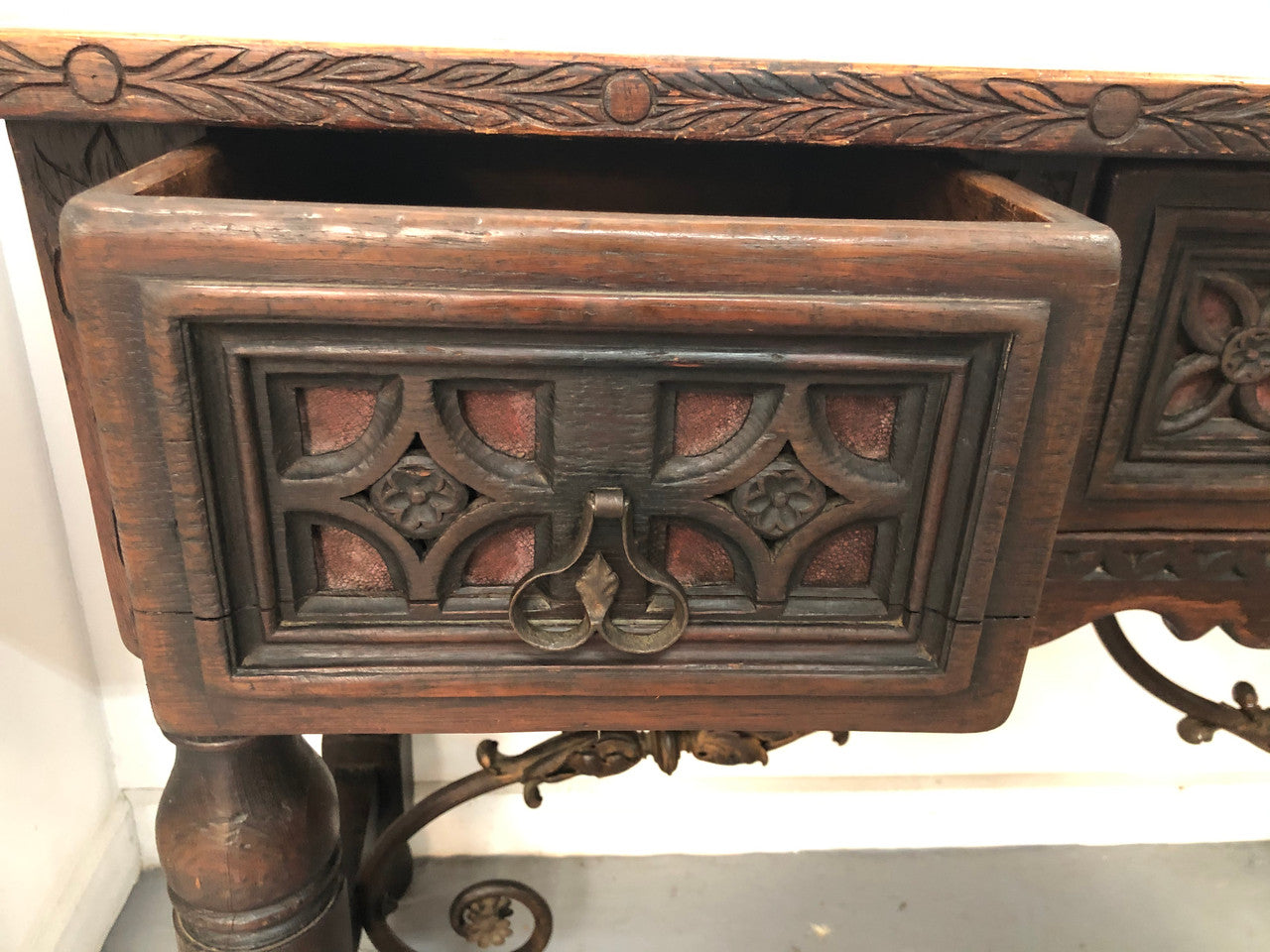 Spanish late 19th century carved oak three drawers console/side table. Superb wrought iron undercarriage. In good condition. Circa 1900's.