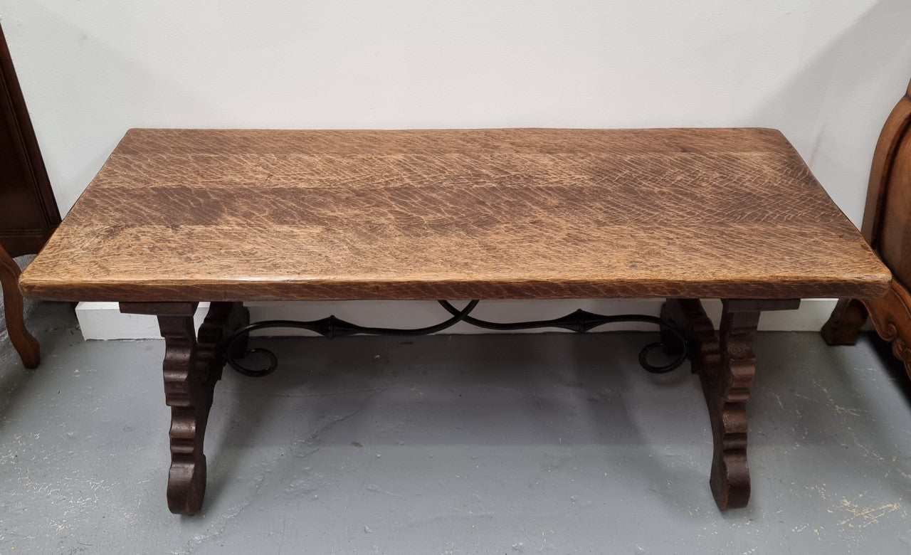 Charming French rustic Spanish style coffee table. It has an amazing rustic top and beautiful iron work. Sourced from France and is in good original detailed condition.