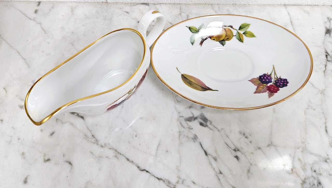 Royal Worcester "Evesham" Pattern small Jug and Saucer. Good Condition no cracks or chips. Please see photos as they form part of the description.