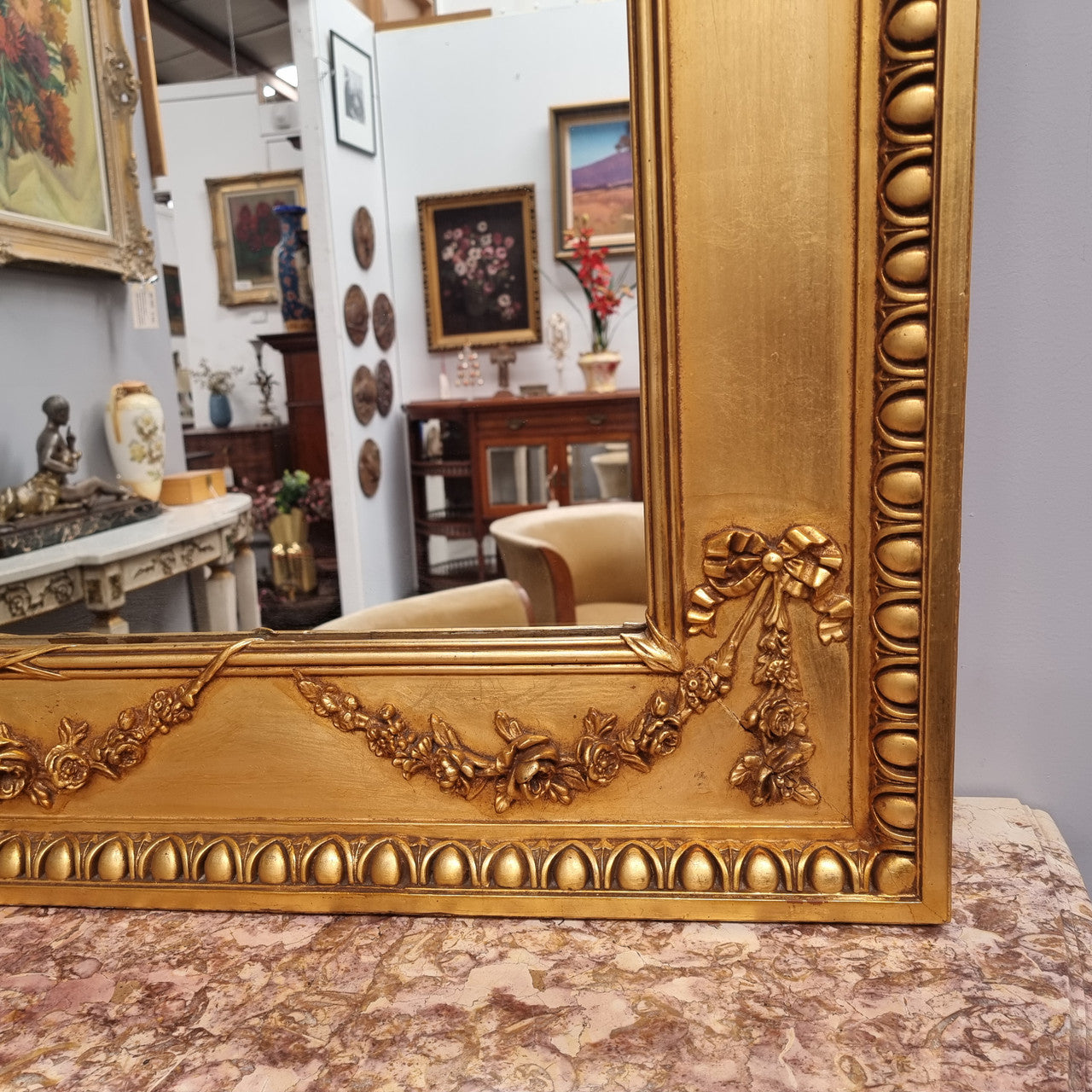 Stunning Vintage French floral gilt framed overmantel mirror. It has been sourced from France and is in good original detailed condition.