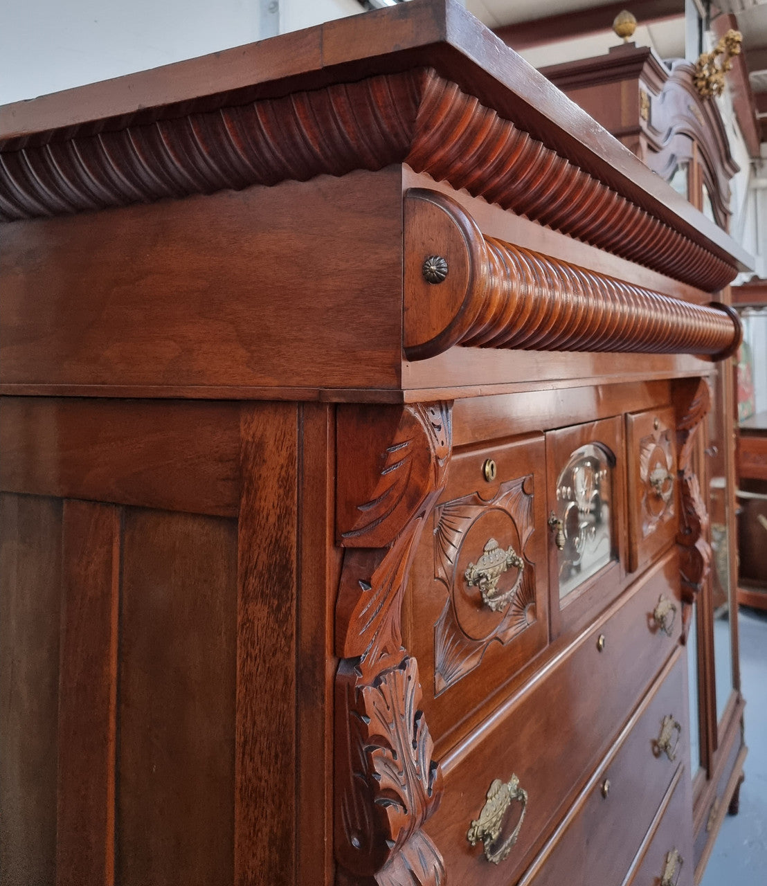 A 19th Century Scottish Mahogany tall boy/ chest of six drawers with small cabinet section at the top. Beautiful carvings and easily comes apart into three sections making transport for moving into place easy. In good original detailed condition.
