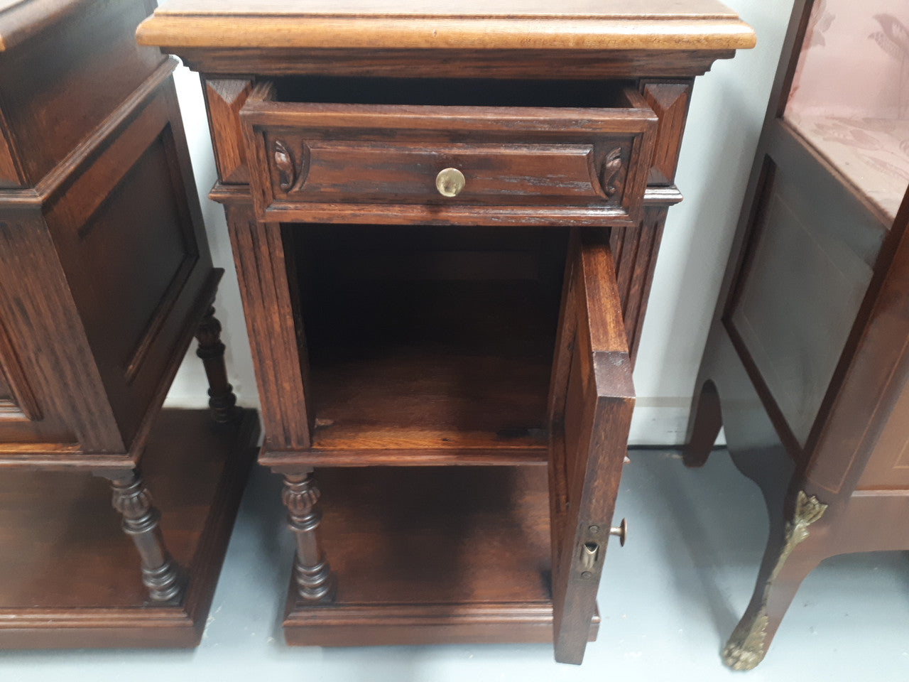 A hard to find pair of French Oak wooden top bedside cabinets. In good original condition. Circa 1920.