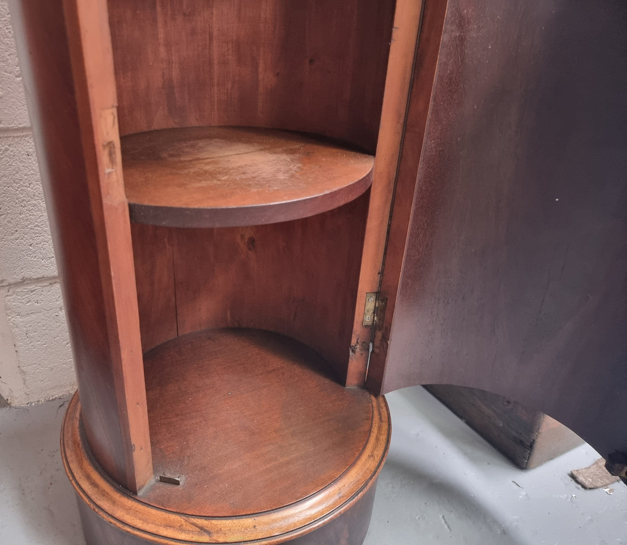 Unusual Empire flame Mahogany cylindrical marble topped bedside/pedestal. Would make an ideal pedestal with added storage inside or could be used as a bedside. Sourced from France and is in good original detailed condition.
