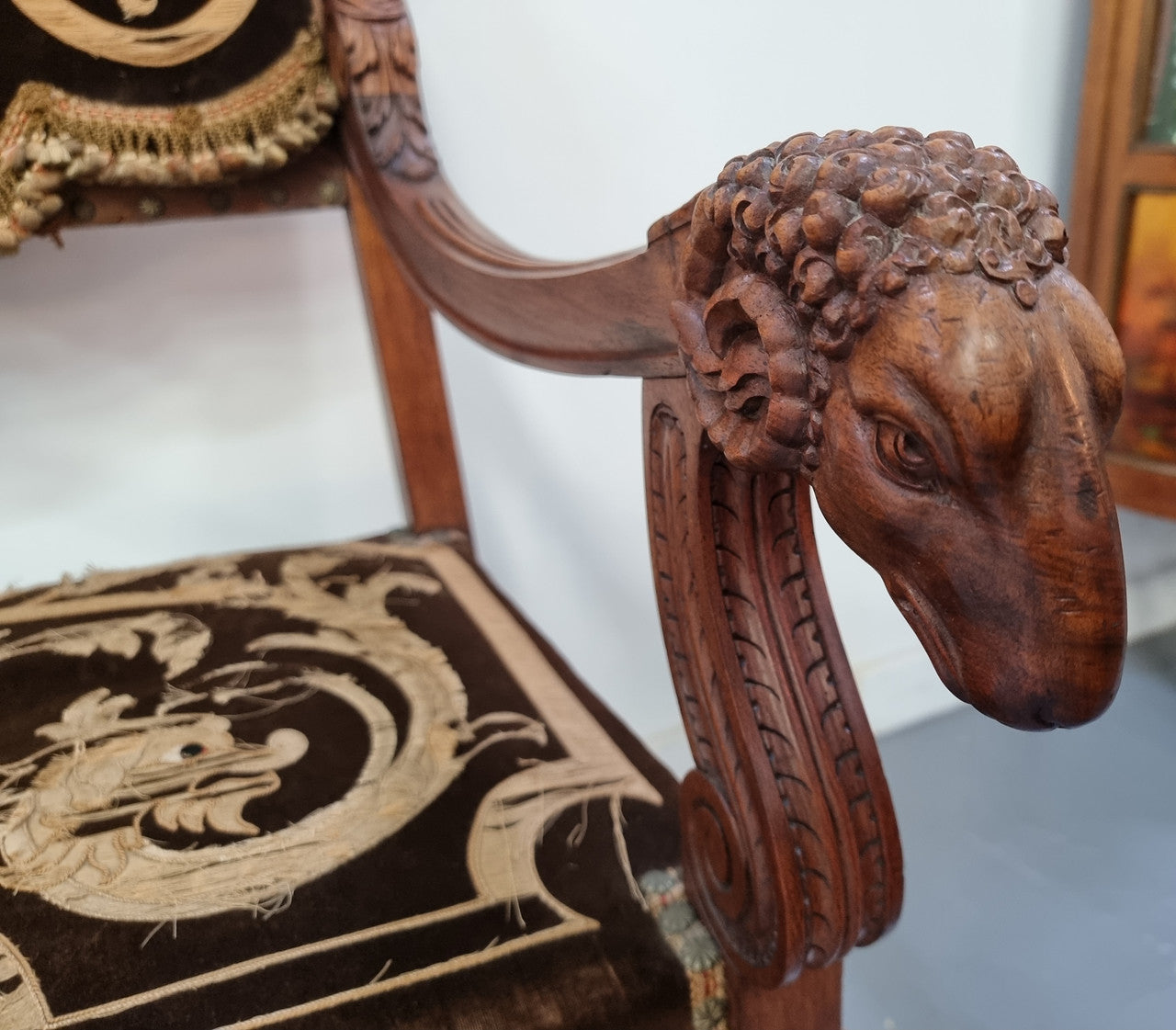 Beautifully carved Walnut Egyptian Revival armchair with amazing hand sewn Stumpwork embroidery coverings. In good original detailed condition.