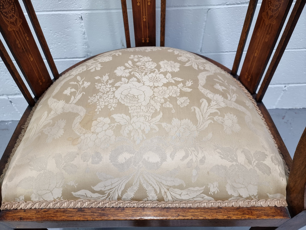 Charming Edwardian inlaid walnut upholstered armchair. In good original condition.