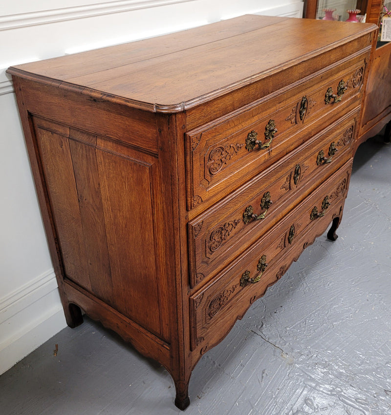 French Louis 15th style large three drawer chest featuring carved drawers. It has been sourced from France and is in good original detailed condition.
